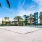 spacious volleyball area with tropical landscaping