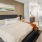a bedroom with a bed and a fan
