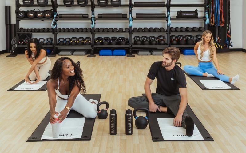 a group of people sitting on mats