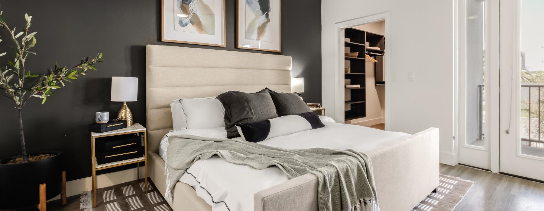 a bedroom with a bed and a fan