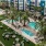 a pool with lounge chairs and palm trees next to a building