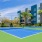 a tennis court in front of a building