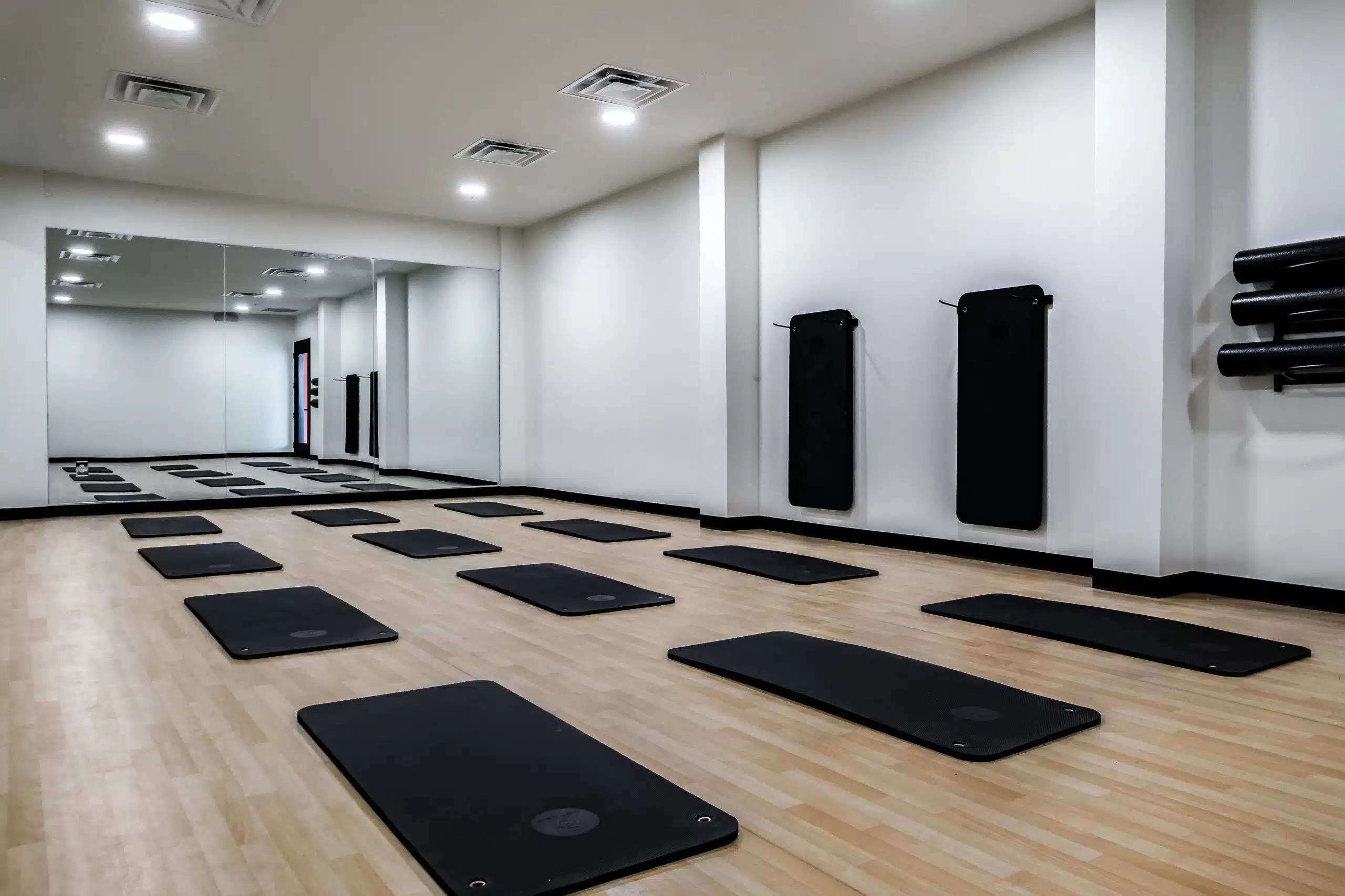 yoga mats set out in a studio