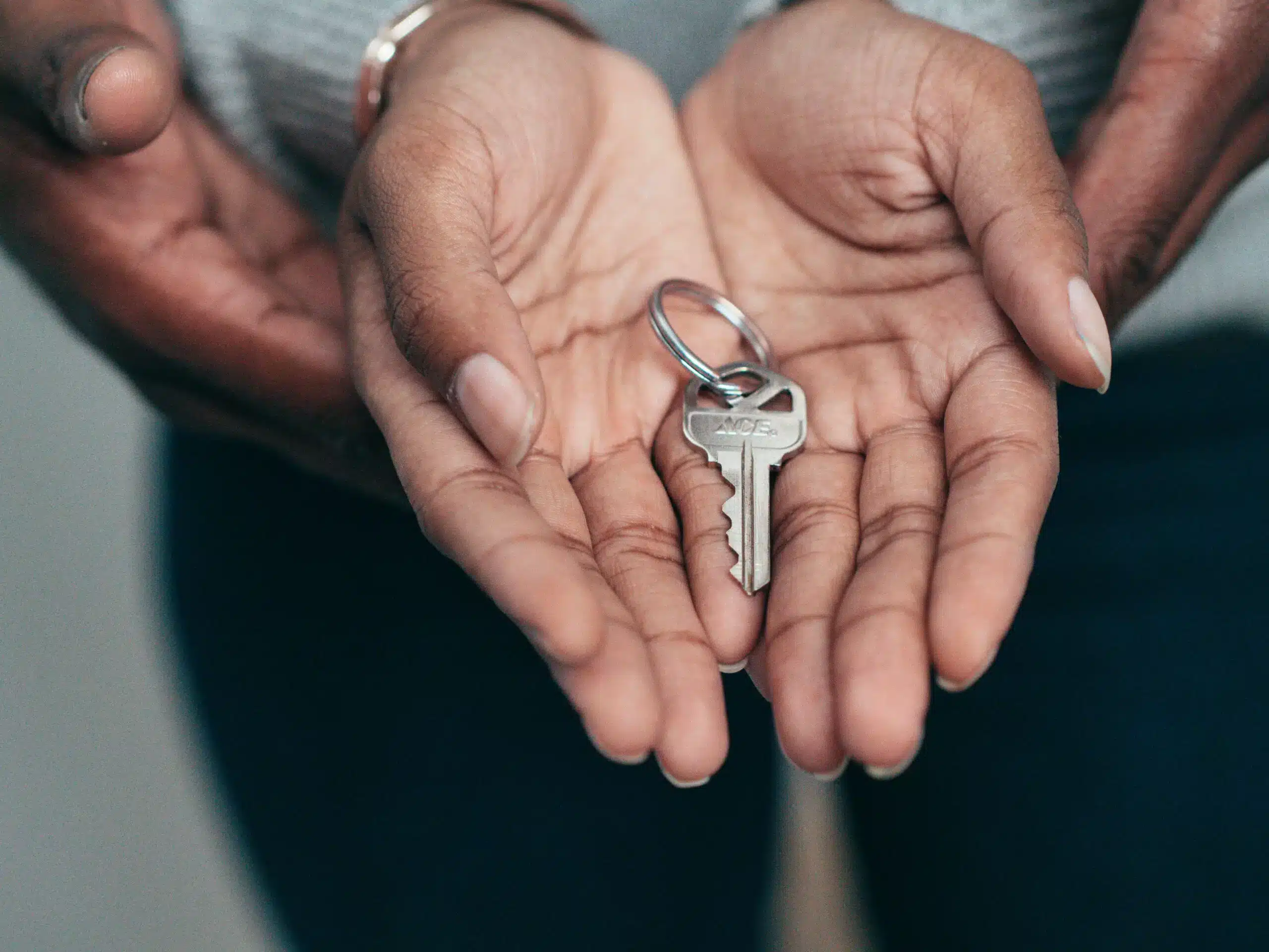 a couple holding a new key in their hands