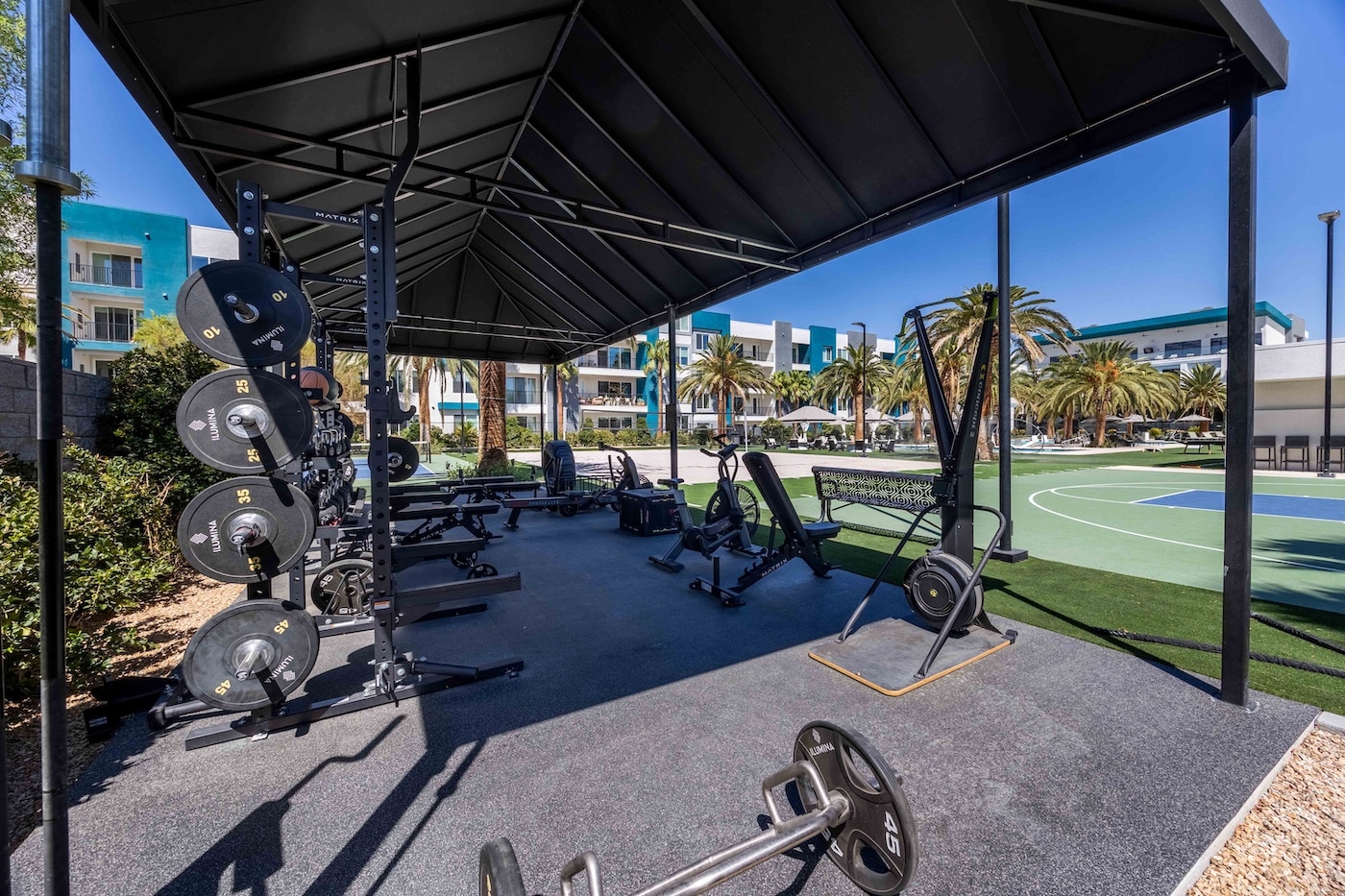 outdoor workout area with weights and machines