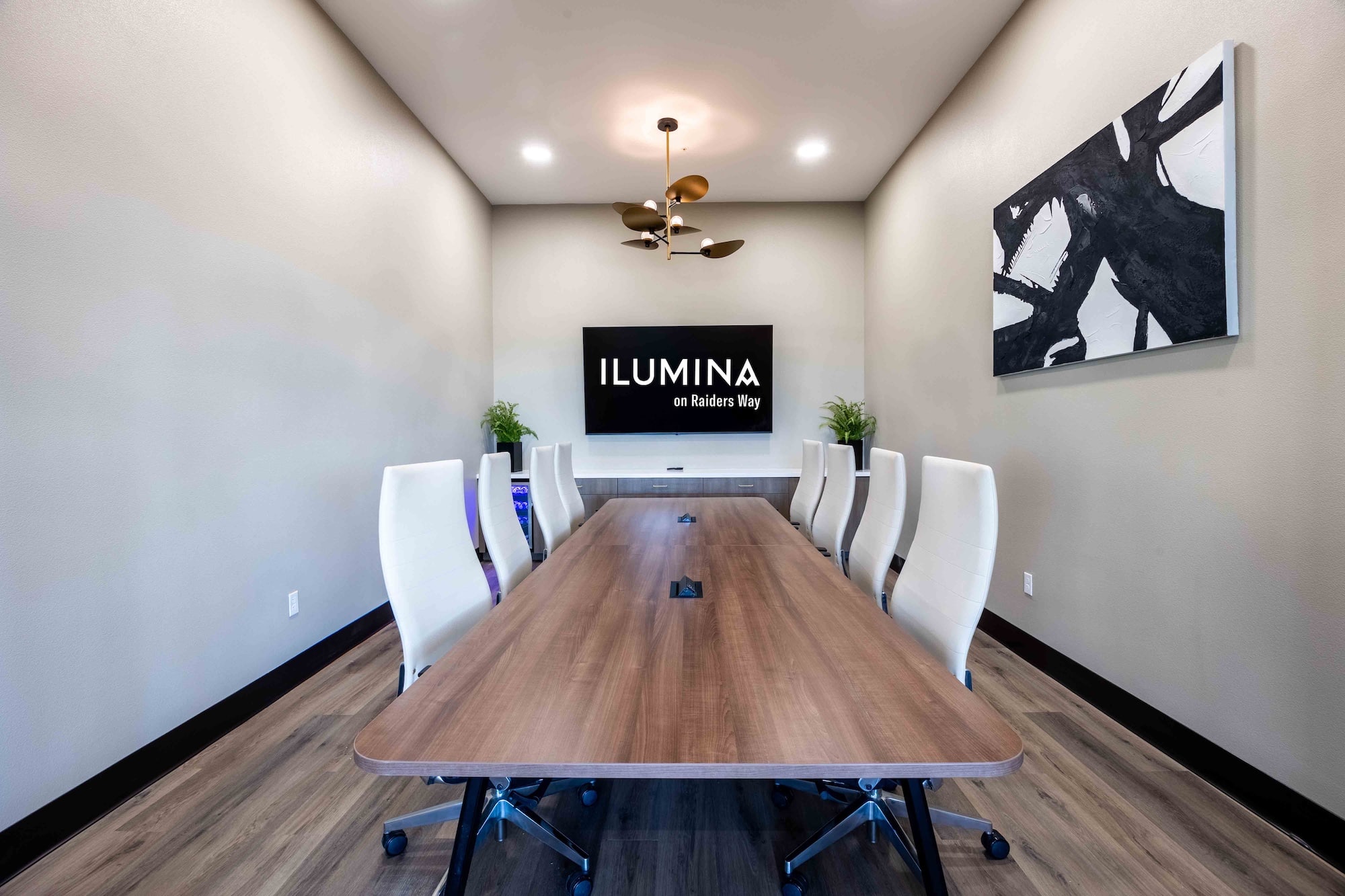 meeting room with long table and 8 chairs